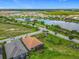 An impressive aerial view showcasing lakefront properties and lush landscaping at 605 San Augusto Dr, Kissimmee, FL 34759