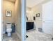 Split bathroom with a toilet in a separate space and a granite countertop vanity at 605 San Augusto Dr, Kissimmee, FL 34759