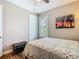 Bright bedroom featuring plantation shutters and a comfortable double bed with floral quilt at 605 San Augusto Dr, Kissimmee, FL 34759