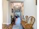 Elegant entryway featuring wood-look tile floors, decorative lighting, and a charming wooden bench at 605 San Augusto Dr, Kissimmee, FL 34759