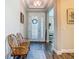 Inviting entryway with decorative glass door, wood-look tile floors, and a comfortable wooden bench at 605 San Augusto Dr, Kissimmee, FL 34759