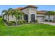 Charming home with lush landscaping, well-maintained lawn, and a tile roof at 605 San Augusto Dr, Kissimmee, FL 34759