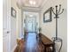 Inviting entryway with hardwood flooring, and view to the front door at 605 San Augusto Dr, Kissimmee, FL 34759
