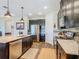 Modern kitchen featuring stainless steel appliances, granite countertops, and dark wood cabinetry at 605 San Augusto Dr, Kissimmee, FL 34759