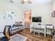 Office space featuring hardwood floors, a desk, and an open floorplan at 605 San Augusto Dr, Kissimmee, FL 34759