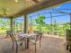Spacious screened patio, ceiling fans, and outdoor dining area create ideal outdoor living at 605 San Augusto Dr, Kissimmee, FL 34759