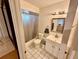 Bathroom featuring a shower, toilet, and white vanity at 651 Elderwood Ct, Kissimmee, FL 34743
