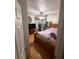 Bedroom with wood floor, ceiling fan, bed and wooden dresser at 651 Elderwood Ct, Kissimmee, FL 34743