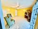 Inviting living room with tile flooring, bright yellow walls, and lots of natural light at 651 Elderwood Ct, Kissimmee, FL 34743