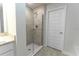Bright bathroom featuring a glass enclosed shower with modern tile surround and neutral toned flooring at 6644 Sw 179Th Court Rd, Dunnellon, FL 34432