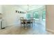Cozy dining area with bright natural light and chandelier at 6644 Sw 179Th Court Rd, Dunnellon, FL 34432
