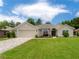 Charming single-story home with well-manicured lawn and a brick driveway at 6644 Sw 179Th Court Rd, Dunnellon, FL 34432