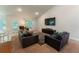 Comfortable living room with sofas, large TV, and bright airy feel at 6644 Sw 179Th Court Rd, Dunnellon, FL 34432
