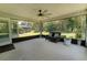 Covered patio with ceiling fan, outdoor seating, and views of the backyard at 6644 Sw 179Th Court Rd, Dunnellon, FL 34432
