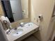 Bathroom featuring a vanity with sink and mirror, complete with amenities and fixtures at 7601 Canada Ave, Orlando, FL 32819