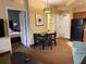Suite showcasing a kitchen, dining area, and a view into a bedroom, offering space and comfort at 7601 Canada Ave, Orlando, FL 32819