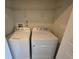 Convenient laundry room with washer, dryer, and overhead shelf at 1069 Pavia Dr, Apopka, FL 32703