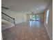 Spacious living area featuring tiled floors, ceiling fan, and glass doors to patio at 1069 Pavia Dr, Apopka, FL 32703