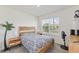 Bedroom featuring natural light, cozy furnishings, and a modern design, ideal for relaxation and rest at 1102 Tupelo Trl, Haines City, FL 33844