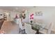 Open concept dining area with a glass table, neutral decor, and natural light, ideal for Gathering meals at 1102 Tupelo Trl, Haines City, FL 33844