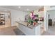 Kitchen island featuring granite countertops, stainless steel appliances, and ample storage for modern convenience at 1102 Tupelo Trl, Haines City, FL 33844