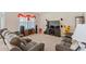 Cozy living room features plush seating, a large screen TV, and speaker system for entertainment at 1102 Tupelo Trl, Haines City, FL 33844