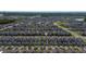 Wide aerial shot showcasing a vast residential neighborhood with uniform housing design at 11328 Listening Dr, Orlando, FL 32832