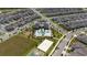 An aerial view of community amenities, including a pool, clubhouse, basketball court, and playground at 11328 Listening Dr, Orlando, FL 32832