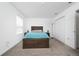 Bedroom with plush carpet, a bed, and stylish lamps on bedside tables, creating a cozy retreat at 11328 Listening Dr, Orlando, FL 32832