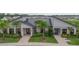 Community clubhouse with welcoming entrance and lush landscaping at 11328 Listening Dr, Orlando, FL 32832