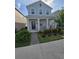 Attractive two-story home featuring a welcoming front porch and well-maintained landscaping at 11328 Listening Dr, Orlando, FL 32832