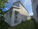 Charming two-story home with a welcoming front porch and lush landscaping at 11328 Listening Dr, Orlando, FL 32832