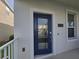 Inviting front entrance featuring a stylish blue door with glass panel and modern hardware at 11328 Listening Dr, Orlando, FL 32832