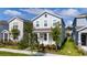 Charming two-story home with a manicured lawn and landscaping at 11328 Listening Dr, Orlando, FL 32832