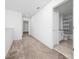 Upstairs hallway with carpet flooring and access to bathroom at 11328 Listening Dr, Orlando, FL 32832