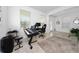 Inviting home office space includes bright light, tiled floors, neutral colors and a pleasant decor at 11328 Listening Dr, Orlando, FL 32832