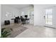 Well-lit home office features tiled floors, modern decor and a lovely exterior door to the front porch at 11328 Listening Dr, Orlando, FL 32832