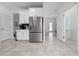 Modern kitchen includes stainless steel appliances, white cabinetry, tiled floors and lots of space at 11328 Listening Dr, Orlando, FL 32832