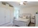 Bedroom featuring neutral tones, a ceiling fan, and ample natural light at 1158 Legatto Loop, Dundee, FL 33838
