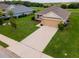 Well-maintained home with a long driveway and a two-car garage in a quiet neighborhood at 1158 Legatto Loop, Dundee, FL 33838