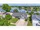 Aerial view of well-maintained home showing a scenic lake view at 121 White Birch Dr, Kissimmee, FL 34743