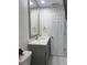 Bathroom with a modern vanity, neutral color palette, and framed mirror offering a clean and inviting space at 121 White Birch Dr, Kissimmee, FL 34743