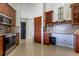 Bright eat-in kitchen features stainless steel appliances, custom cabinets and beautiful countertops at 121 White Birch Dr, Kissimmee, FL 34743