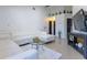 Bright living room with tile floors, a sectional sofa and a wall-mounted television at 121 White Birch Dr, Kissimmee, FL 34743