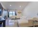 Bright living room boasts tile floors, a comfortable white sofa, and sliding glass doors at 121 White Birch Dr, Kissimmee, FL 34743