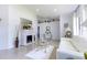 Bright living room featuring tile floors, white sofa, and decorative fireplace at 121 White Birch Dr, Kissimmee, FL 34743
