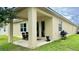 Covered patio with outdoor seating and grill, perfect for entertaining at 1222 Yorkshire Ct, Davenport, FL 33896