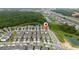 Scenic aerial shot of the neighborhood showcasing the tranquil ponds and well-maintained residential streets at 1335 Greenfield Loop, Kissimmee, FL 34747