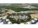 Aerial view of the community's resort-style pool, townhomes and surrounding green spaces at 1335 Greenfield Loop, Kissimmee, FL 34747