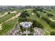Stunning aerial view of a golf course neighborhood showcasing the swimming pool and clubhouse at 1335 Greenfield Loop, Kissimmee, FL 34747